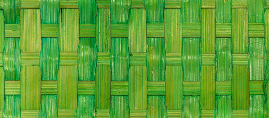 A weave pattern of a bamboo basket. Wide bamboo texture as a header