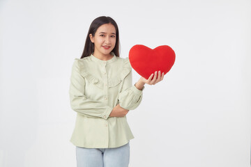 young attractive woman holding a red heart