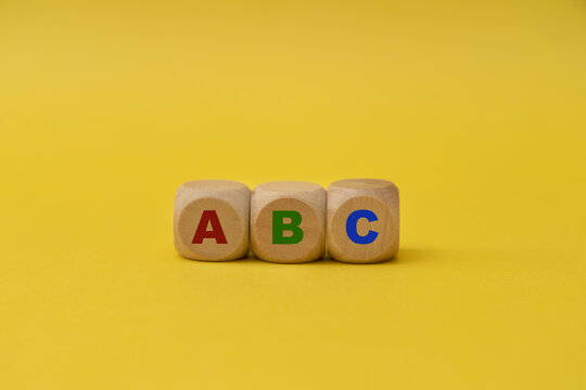 ABC written on wooden blocks.