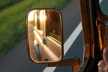 reflection of the car at the sunset