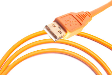 Orange USB rolled cable isolated on white background