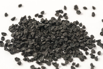 onion seeds on white background