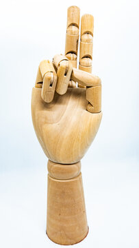 Vintage Wooden Mannequin Holding Up Two Fingers As If Indicating The Number 2