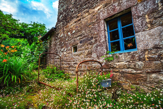 france old rural brittany, flowers garden stone house