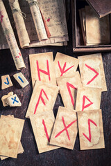 Weird fortune teller from futhark rune cards and antique scrolls