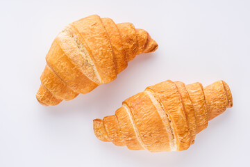delicious fresh croissant on a white acrylic background