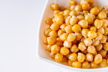 boiled chickpeas on a white acrylic background