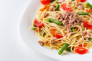 delicious traditional Italian pasta with tuna on a white background