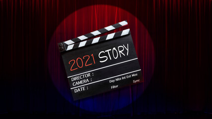 2021 story ,text title on movie Clapper board and theatre curtains background.