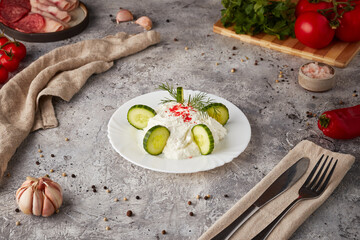 Curd cheese salad with cucumber, textured background