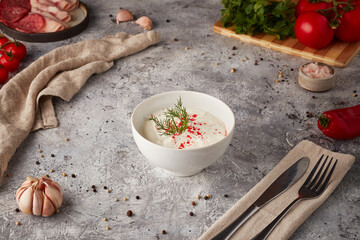 Curd cheese sauce with spices, textured background