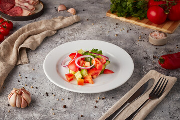 Vegetable salad with fresh vegetables, textured background