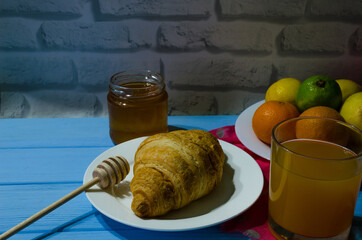 Still life with fresh fruits and glass of juice on the wooden background