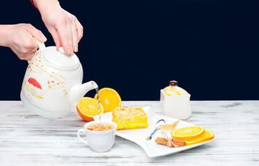 Hot tea with a mug spoon oops orange slices and sugar. Cozy home tea concept