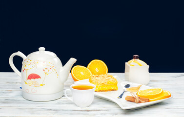 Hot tea with a mug spoon oops orange slices and sugar. Cozy home tea concept