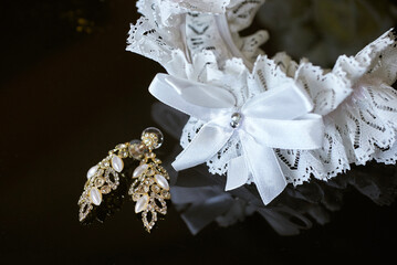 luxury earrings made of crystals and rhinestones and the bride's