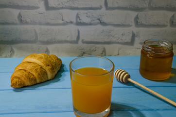 Still life with fresh fruits and glass of juice on the wooden background