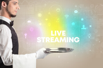 Waiter serving social networking with LIVE STREAMING inscription, new media concept