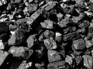 Natural black coals background texture. Top view of fuel for industrial carbon.