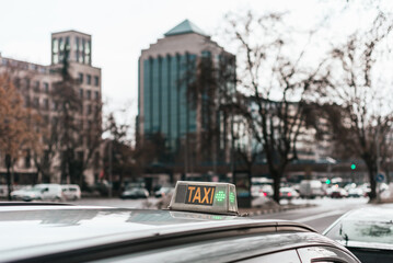 Closeup shot of a taxi sign on a car