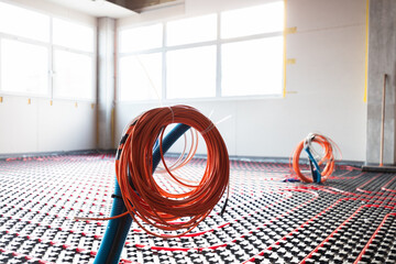 Floor heating and electrical outputs in a new building. Interior design