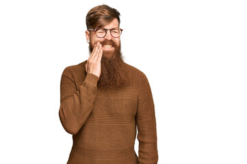 Young irish redhead man wearing casual clothes and glasses touching mouth with hand with painful expression because of toothache or dental illness on teeth. dentist