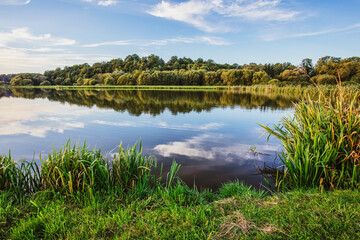 Lake at sunset. Countryside rural scenery in Poland