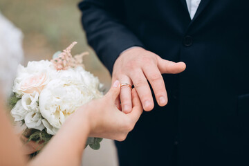 bride and groom holding hands