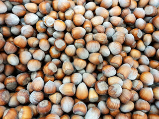 Hazelnuts food background texture.