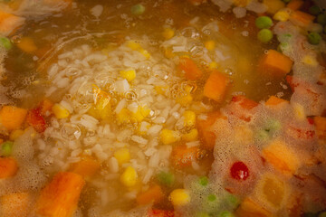 colorful vegetables cooking soup boiling water