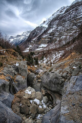 mountain gorge at the end of winter with snow in the Pineta Valley in the Aragonese Pyrenees