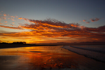 beach in nelson during a breathtaking sunset on Tahunanui Beach at Nelson, New Zealand