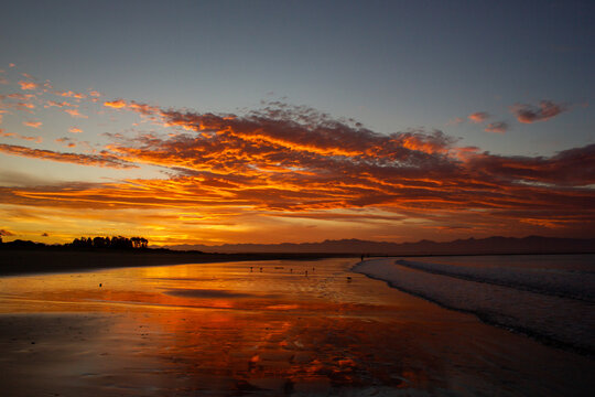 beach in nelson during a breathtaking sunset on Tahunanui Beach at Nelson, New Zealand