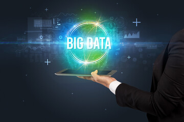 Close-up of a touchscreen with BIG DATA inscription, new technology concept