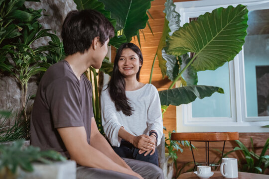 Asian Young Couple Having First Date In The Park