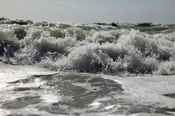 Bubbling waves approaching the beach