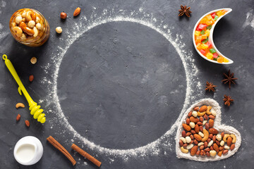 Wheat flour with bakery ingredients for homemade cookies baking on table