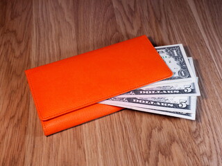 Wallet with dollars. Economic forecasts. Purchasing power of the population.