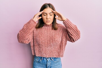 Young beautiful woman wearing casual clothes with hand on head, headache because stress. suffering...