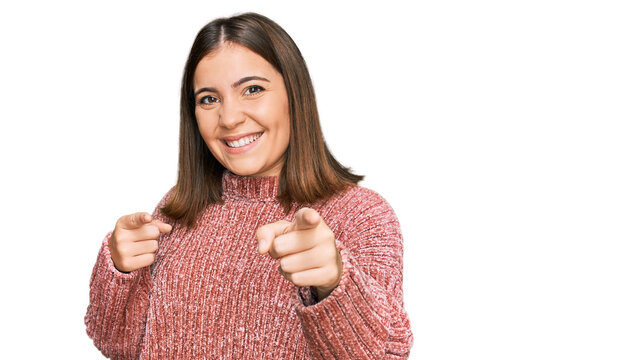 Young beautiful woman wearing casual clothes pointing fingers to camera with happy and funny face. good energy and vibes.