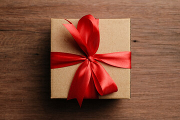 Flat lay of giftbox over wooden background, love and gift concept