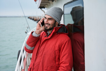 Man using smartphone while connecting with colleagues