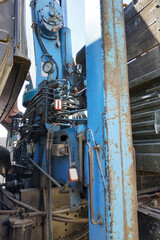 Manual mechanism of mobile crane. Crane levers for lifting cargo.