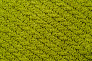 Green knitted cable pattern texture background