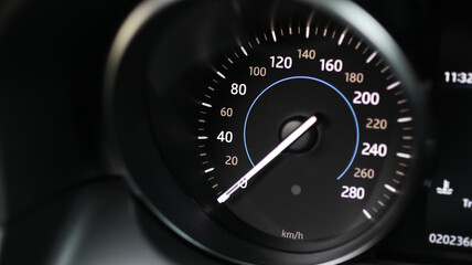 Closeup shot of a speedometer of a luxurious black car