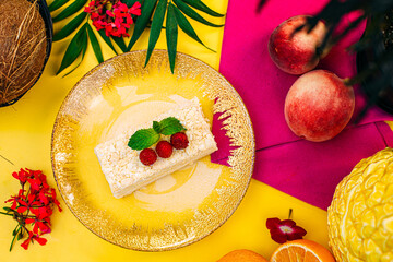 a slice of napoleon cake with raspberries on a decorated table