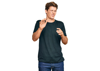 Handsome caucasian man wearing casual clothes disgusted expression, displeased and fearful doing disgust face because aversion reaction. with hands raised