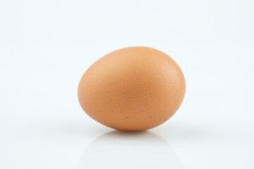 Chicken eggs in nest of straw. Isolated on white background.