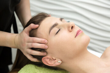 Fototapeta na wymiar Head massage, skin under hair and temples. Close-up