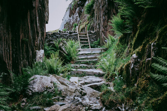 A Wooden Style Over A Slate Path In Snowdonia 